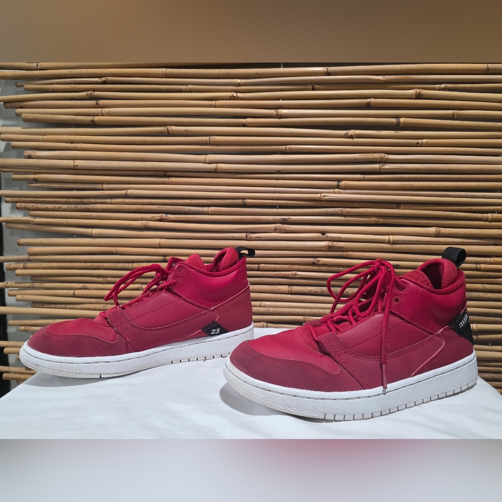 Nike Jordan Fadeaways size 6.5 youth red high-top sneakers with lace-up design.